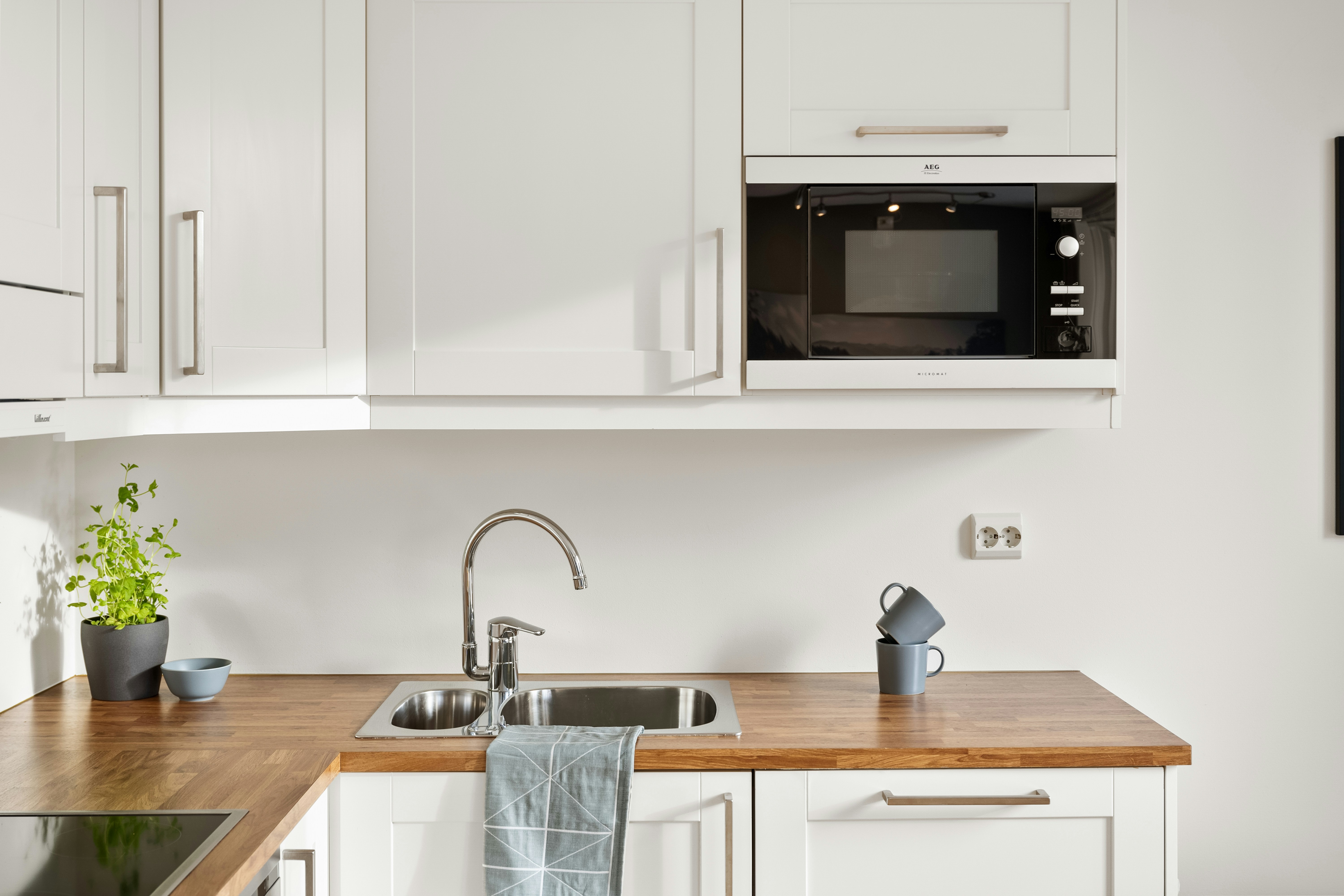 Built-in microwave integrated into kitchen cabinetry